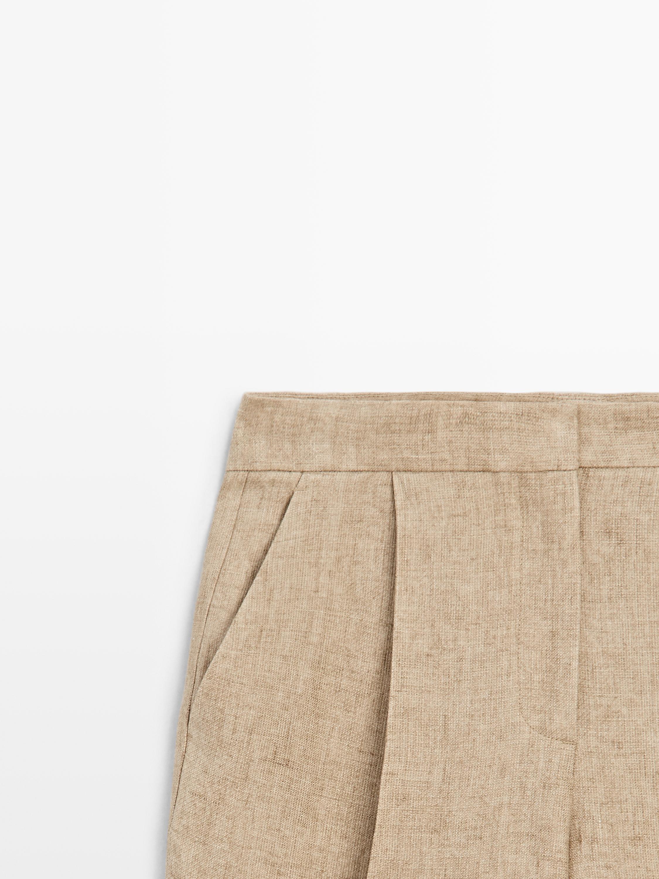 Flowing linen trousers with darts